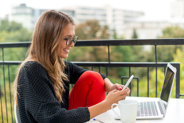 Smiling Young woman with mobile phone