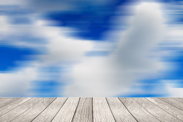 Soft white wooden with blurred image of blue sky background for put your products.
