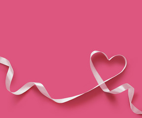 Happy Valentines Day. White Ribbon Heart on pink background. Valentines Day concept