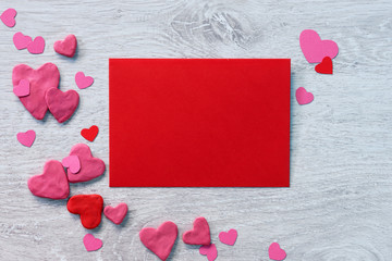 Valentine red card with valentines heart shaped  on a white wooden background. Valentines Day...