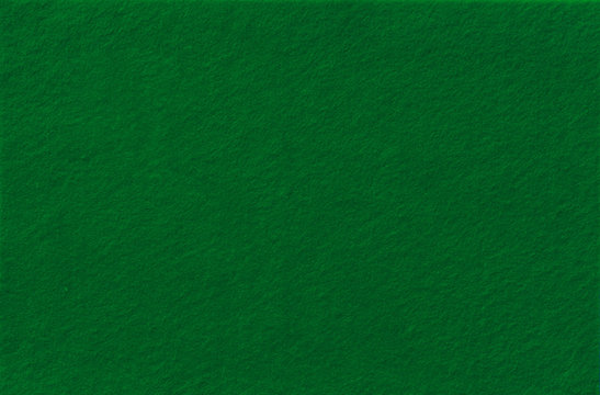 Dark Green Felt Background for design. View from above. Close up.
