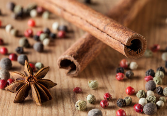 Pepper mix, cinnamon,  truestar on wooden  background
