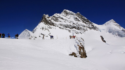 Fototapeta na wymiar Snow and high Mountain in Switzerland for your holiday trips.