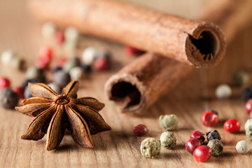 Pepper mix, cinnamon,  truestar on wooden  background
