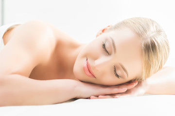 Fototapeta premium Beautiful girl sleeping and have a spa treatment isolated on white.
