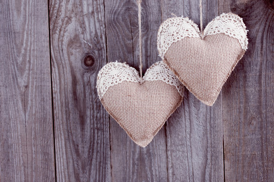 Two sackcloth handmade hearts with lace
