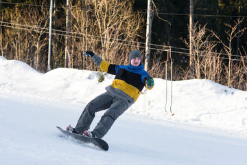 Fototapeta na wymiar snowboarder laying turns on the ski slope
