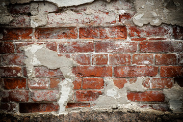 Dirty red brick wall.