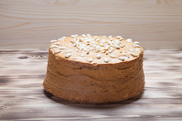 Homemade peanut cake on wooden background. Selective focus