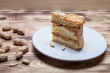 Homemade peanut cake on wooden background. Selective focus