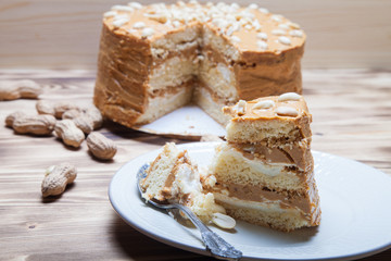 Homemade peanut cake on wooden background. Selective focus