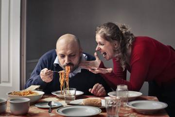 Fototapeta na wymiar Greedy husband eating pasta