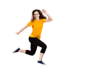 Teenage girl jumping on white background 