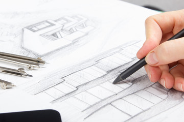 Architect working on blueprint. Architects workplace - architectural project, blueprints, ruler,...