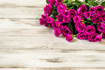 Flowers roses on wood. Background with copy space.