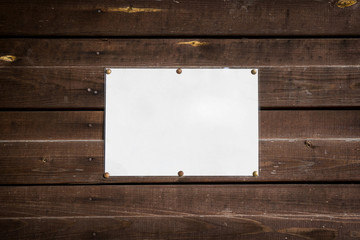 empty standard sheet on a wooden wall