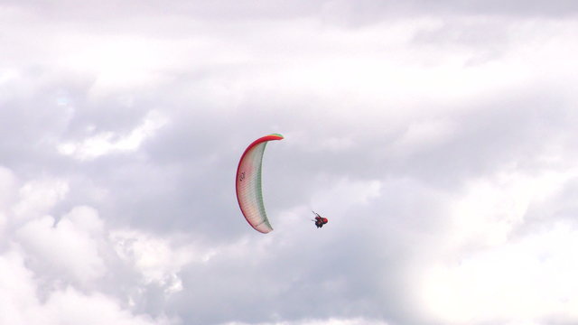Experience the thrill of extreme sports with tandem paragliding and rapid diving,as you soar through the air in a thrilling circular motion.