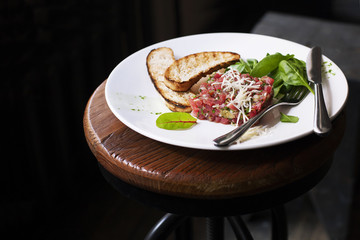 Tartare of beef with spinach.