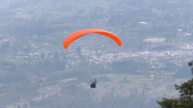 Experience the thrill of a solo paraglide flight over Patate City in Central Ecuador's Tungurahua Province,offering breathtaking views and unforgettable adventures.
