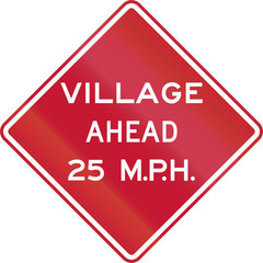 Traffic sign in the United States warning of village ahead with an advisory speed