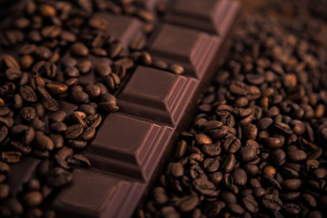 Roasted coffee beans and chocolate bar  close-up