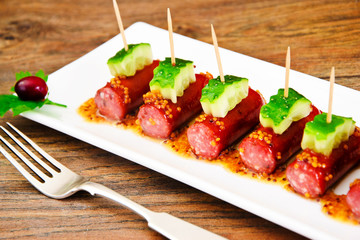 Cocktail Sausage and Cucumber on Plate