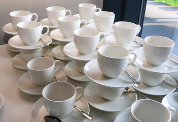 Stacked saucers ready to serve guests