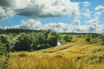 Fototapeta premium Russian field by the river in Moscow country side