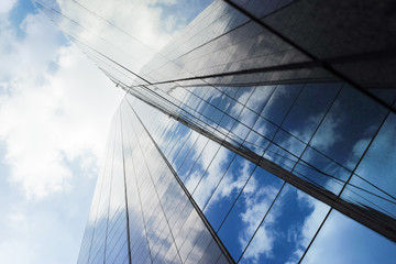 Fototapeta na wymiar Abstract office windows and blue sky refection.