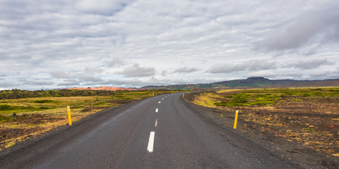 Fototapeta na wymiar Isolated road and Icelandic colorful landscape at Iceland, summe