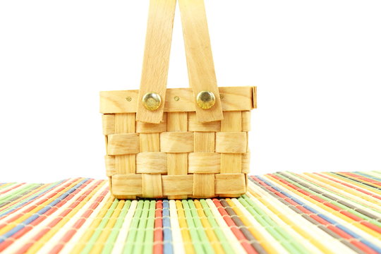 bamboo basket on white background on bamboo mat