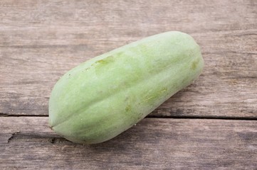 green papaya on wood plank