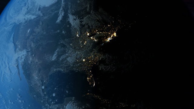 Global 0510: Planet Earth rotates from day into night as city lights turn on in North America.