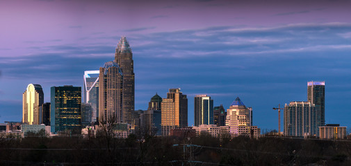 Watching the sunlight bounce off of the buildings in uptown Charlotte, North Carolina during sunrise.  - 102639787
