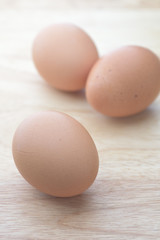egg on brown wooden background