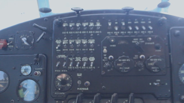 The pilot controls the aircraft using levers, small aircraft