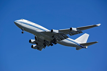 flying airplane on blue sky background