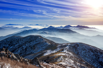 Fototapeta na wymiar Winter landscape with sunset and foggy in Deogyusan mountains, South Korea.