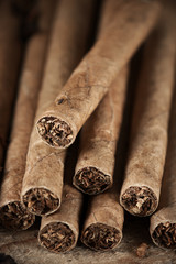Cigars pile on wood