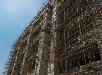 Construction building with bamboo scaffolding