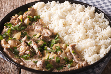 beef stroganoff with mushrooms and rice close-up. Horizontal
