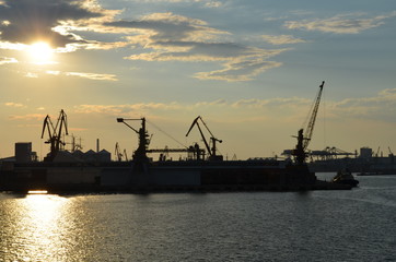 Fototapeta na wymiar Cargo port dock at sunset
