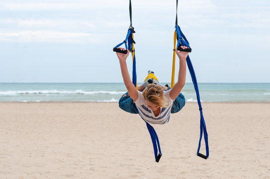 Young woman making  yoga. fly-yoga 