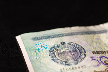Fototapeta na wymiar Uzbekistan banknote of five thousand sum close up