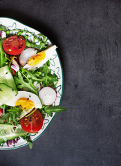 Greek salad in red boul