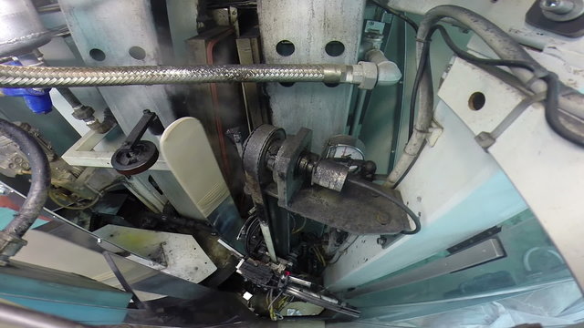 Steam Ironing Machine in Textile Mill / Steam ironing machine with a cloud of hot steam in a textile industry. HD1080p.