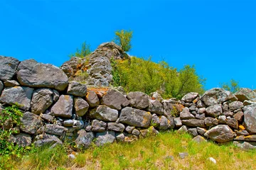 Fototapete Vulkan mur pierres volcanique