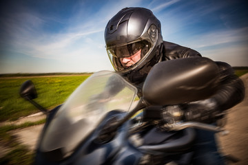 Biker racing on the road