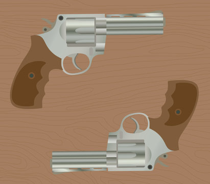 pistol handgun gun isolated revolver with wood background