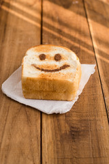 Happy toasted on wooden table.